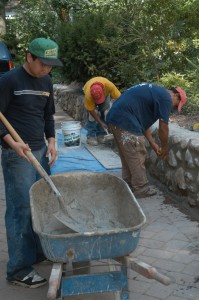 expert masons rebuild wall