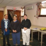 Pastor Blair and staff members Elias and Angelica announce the grant at the lunch program