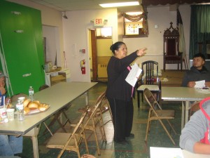 Angelica advises workers at a lunch program on wage theft issues