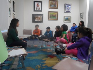 Teacher Jenny helps the children learn vowel sounds in the new Spanish Story Hour